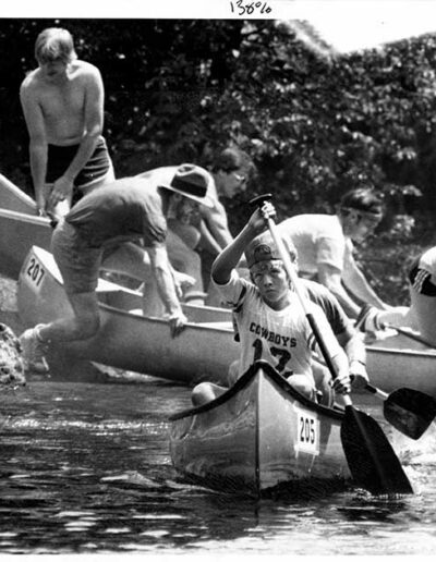 Boy rowing canoe Hanmer Race