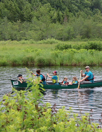 Family in blue Canoe Hanmer Guideboat Race
