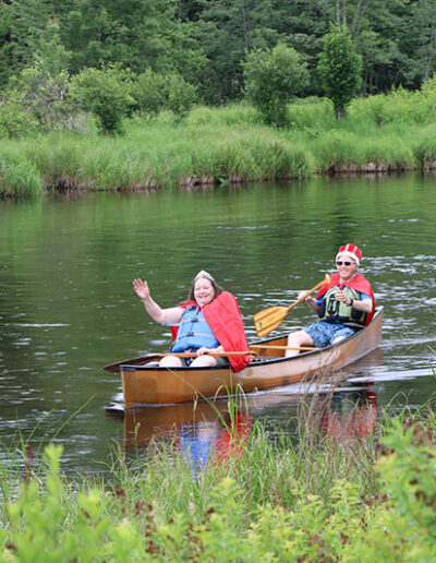 King and Queen of Hanmer Guideboat Race in a Canoe near the Saranac Lake Fish and Game Club.