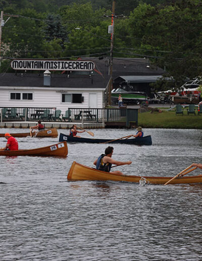 Four Adirondack Guideboats on Lake Flower during the Hanmer Guideboat Race.